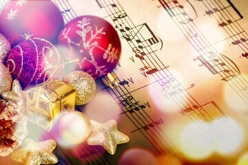 Fototapeta na wymiar Christmas Music concept. Christmas decorations on music sheets