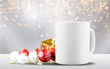 White tea mug with winter xmas decorations and copy space for your design. Christmas promotional content.