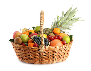 Assortment of fresh exotic fruits in wicker basket on white background