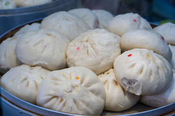 Traditional Chinese steamed bun in tray, Dumping chinese food or dim sum for sell in Chinatown market, Singapore