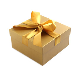Golden gift box with satin bow on white background