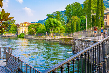 Fototapeta Romantic lakefront and Villas in Como walkway, tourist destination on Lake Como. The city contains numerous works of art, churches, gardens, museums, theatres, parks, and palaces obraz