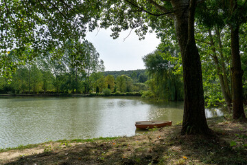 Small boat moored on the lake shore