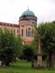 A statue of Jesus in the background with the Basilica of Esztergom