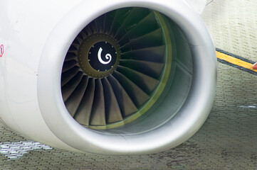 
aircraft engine detail on airport runway