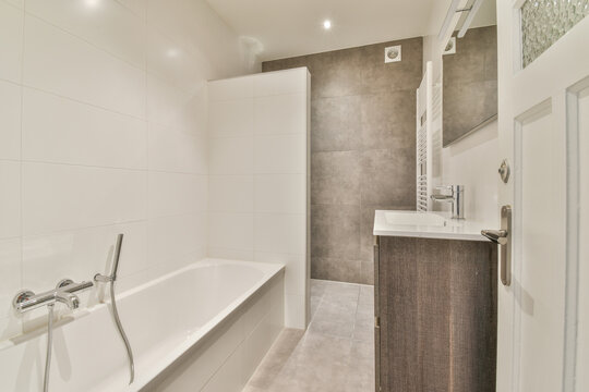 Modern bathroom interior with bathtub and sink