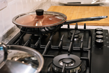 Frying pan on electric stove in kitchen