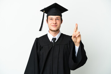 Young university Russian graduate isolated on white background with fingers crossing and wishing the best