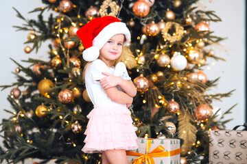 Happy little girl hugs her favorite toy in the room