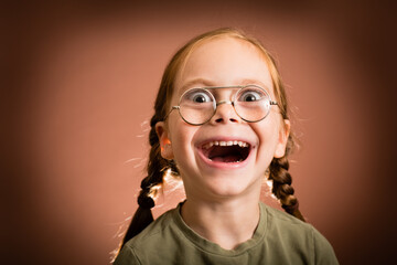 Excited Young Girl with Thick Eyeglasses, Making a Funny Face