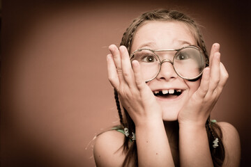 Excited Young Girl Wearing Vintage Glasses