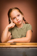 Young Girl Student Sitting in School Desk