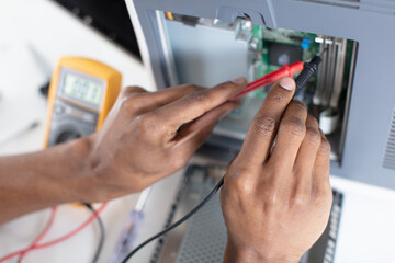 computer technician installs cooling system of computer