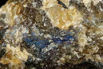 macro mineral stone Labradorite on a black background