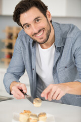 closeup of a man preparing tapas
