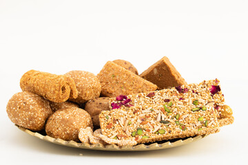 Winter Delicacy Makar Sankranti Or Lohri Mithai Gulab Gajak, Pista Gazak, Til Patti Or Papdi, Til Laddu Or Ladoo, Revdi And Rewri Is Made Of Tilgul, Mungfali, Sesame Seed, Jaggery Gud, Badam And Pista