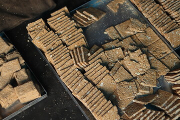 Large Tray With Fresh Baked, Sliced And Processed Delicious Indian Mithai Known As Gajak Bars, Gajjak Burfi, Gazak Barfi, Chikki, Til Papdi Gur Patti Or Gachak Made Of Sesame Seeds And Jaggery