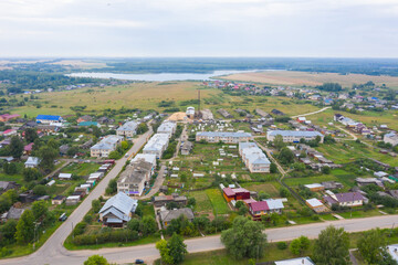 Aerial view from a drone of a rural village in the Kirov region, private houses and vegetable gardens in the village of Arbazh.