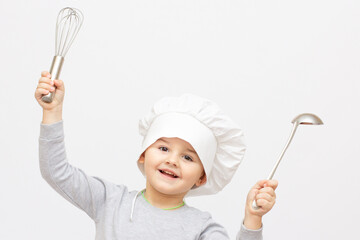 Fototapeta premium Happy little chef with a whisk, on white background.