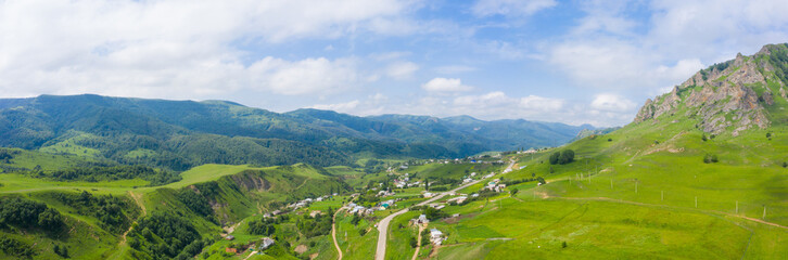 Fototapeta na wymiar A wonderful mountain road with a serpentine Gum-Bashi pass in the North Caucasus, Russia.