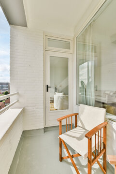 Wooden chairs on balcony of residential house