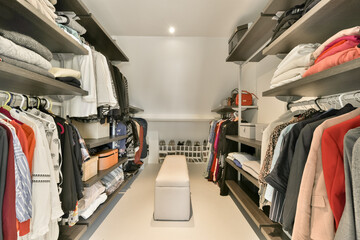 Modern wardrobe with organized clothes