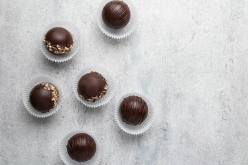 Hot cocoa chocolate ball bomb with marshmallow. Holiday winter drink. Handmade Christmas present. Top view, copy space.