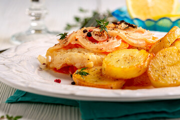 White sea fish baked with vegetables.
