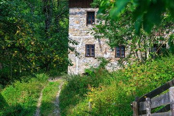 Obraz na płótnie Canvas an old stone House during a hike near Kranjska Gora, slovenian alps