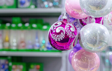 Purple, pink and pearl Christmas balls in a bunch.