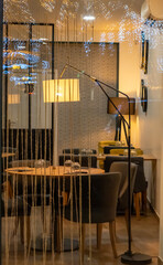 Stroll in the city center, restaurant table set in a quiet corner lit by an intimate mood lamp