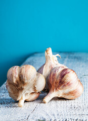 Garlic bulbs on wooden background