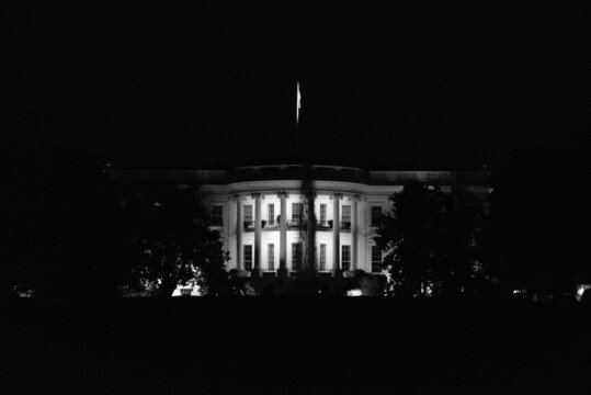 Monochrome photo of the White House in Washington at night