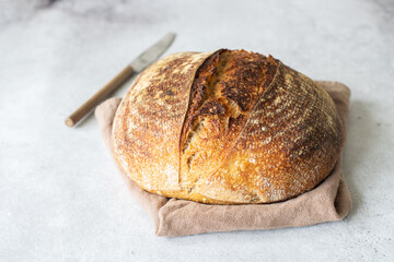 Artisanal sourdough bread on a napkin - obrazy, fototapety, plakaty