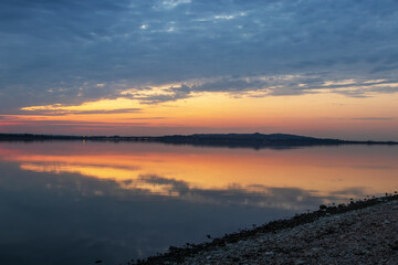 Beautiful evening landscape. View of Pálava - Moravia - Czech Republic. Lake Musov and vineyards at sunset.