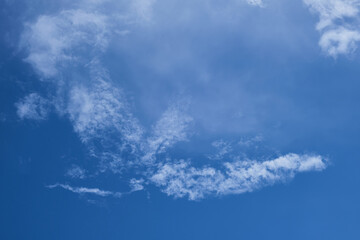 Partly clouds and blue sky. Pieced clouds.