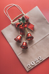craft Christmas package with a gift on a red background