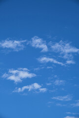 Partly clouds and blue sky. Pieced clouds.