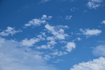 Partly clouds and blue sky. Pieced clouds.