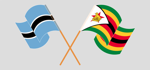 Crossed flags of Botswana and Zimbabwe. Official colors. Correct proportion