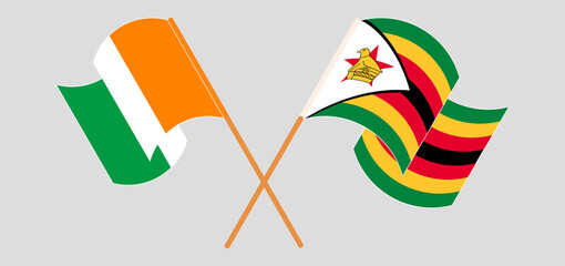 Crossed flags of Ivory Coast and Zimbabwe. Official colors. Correct proportion