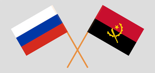 Crossed flags of Russia and Angola. Official colors. Correct proportion