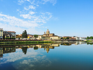 Fototapeta na wymiar view of Florence`s buildings reflected in the waters of Arno River - Florence, Italy