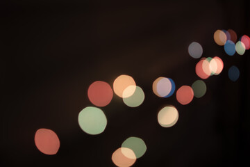 New Year glare from a garland on a black background