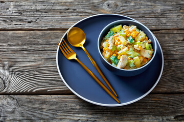 salad of chicken breast, corn, ananas, cucumber