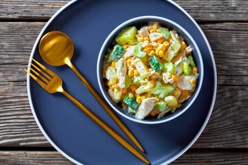 salad of chicken breast, corn, ananas, cucumber