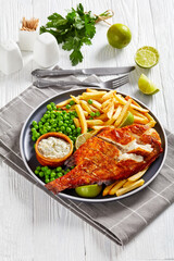fried redfish with chips, green peas, tartar sauce