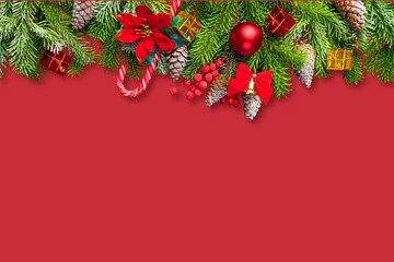 Banner with fir branches and Christmas decorations on desk background.