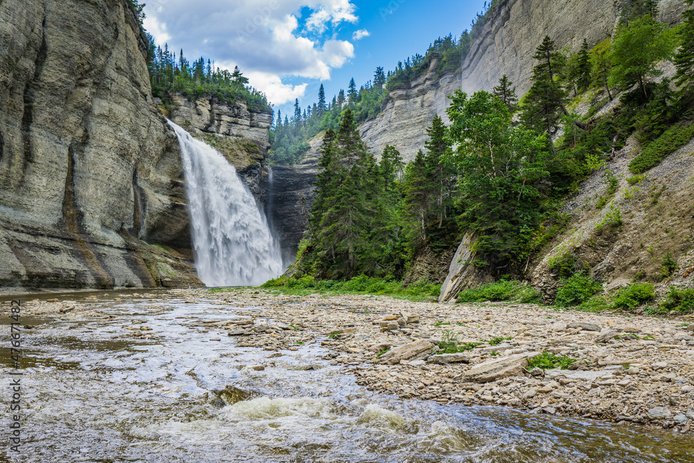 Wall mural View on the Vaureal waterfall from the canyon, the most impressive waterfall of Anticosti Island, in Cote Nord region of Quebec, Canada