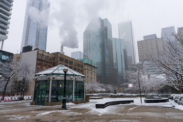 Toronto, Ontario, Canada - December 18 2021 : David Pecaut Square in a snowy winter day. Toronto...